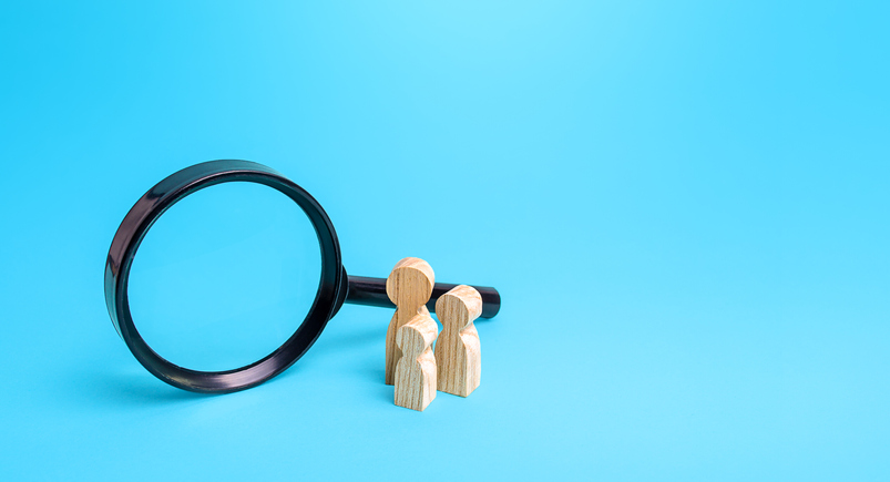 Figurines And Magnifying Glass