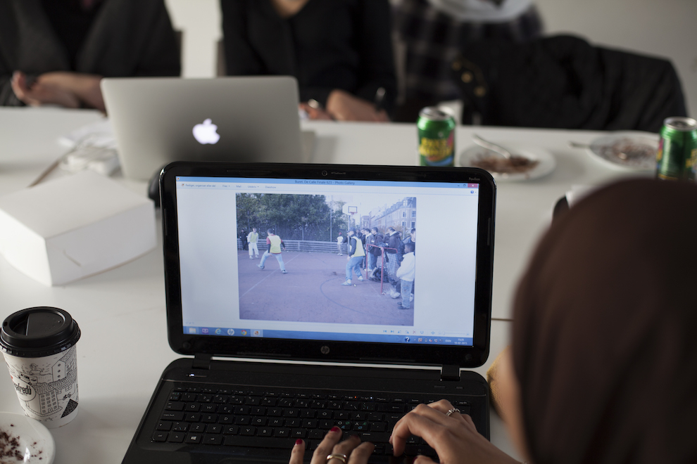 Photovoice Example Person Looking At Photo On Laptop