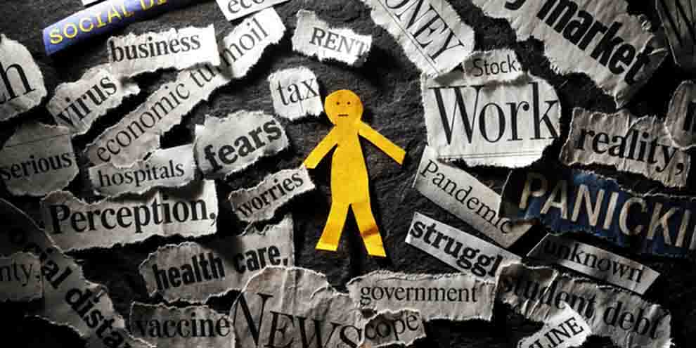 Yellow Paper Doll Surrounded Newspaper Clippings Describing Uncertainity