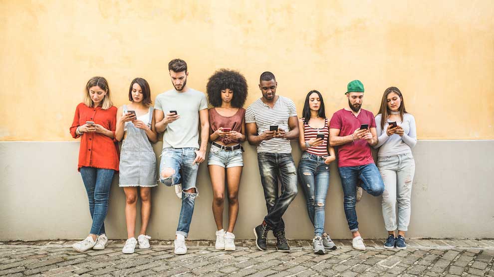 A Group Of Gen Z Individuals On Phones