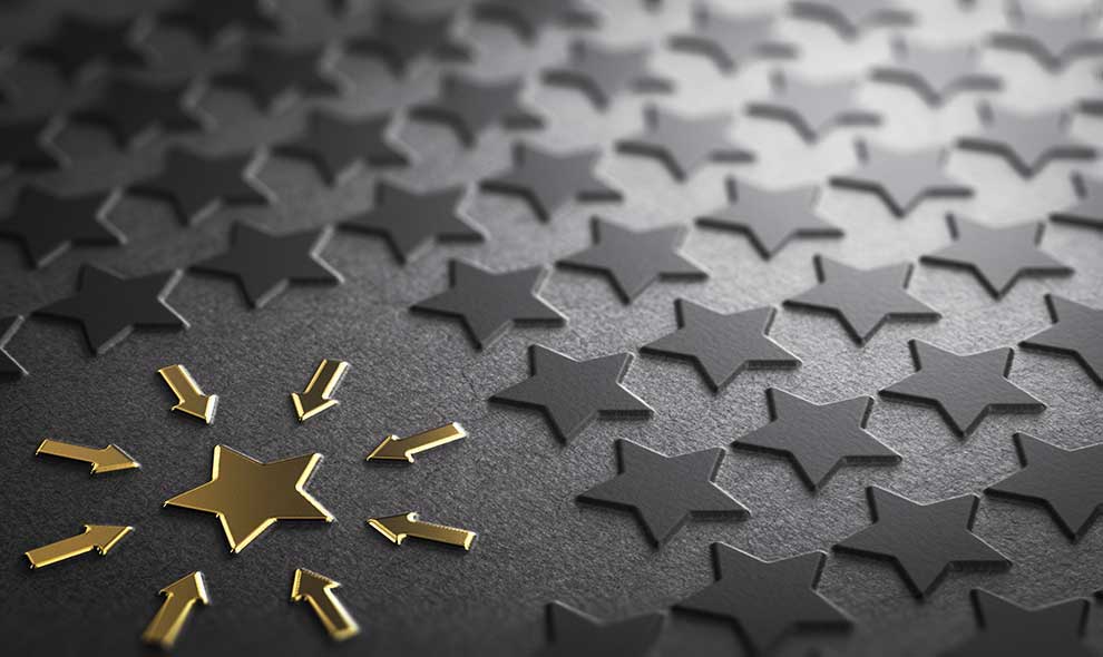 Gold Arrows Pointing To A Gold Star