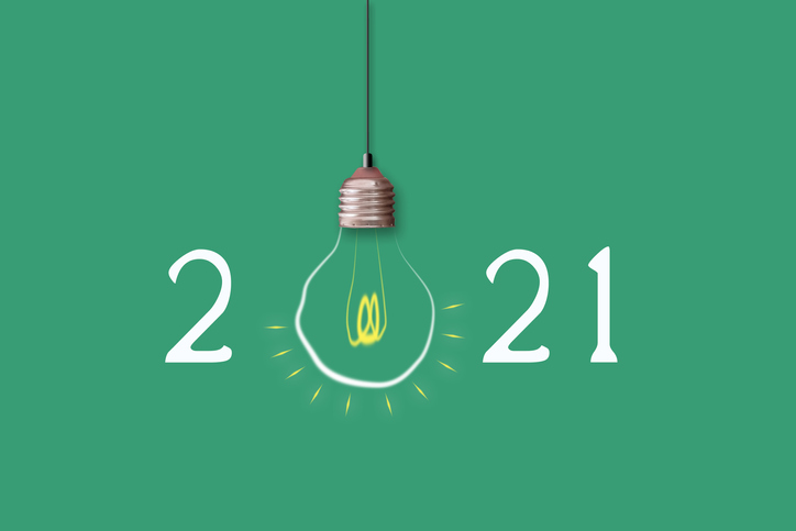021 Light Bulb On A Green Background