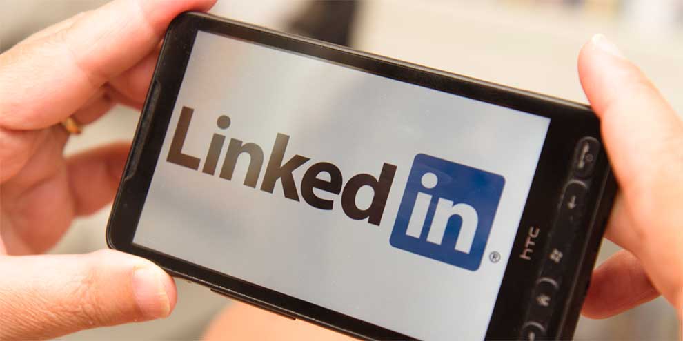 Person Looking At Linkedin On Phone
