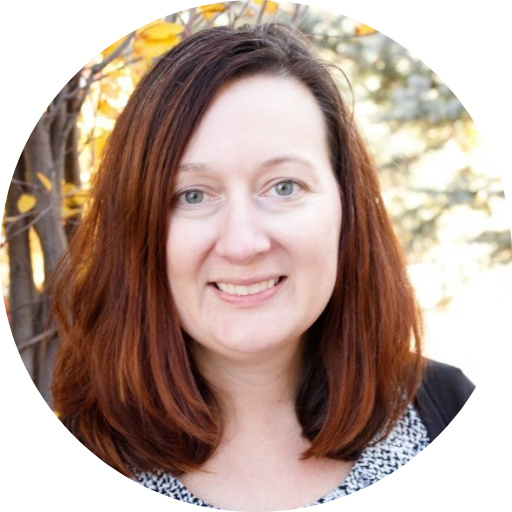 Erica Dinger’s circular headshot with a woodsy autumn background.