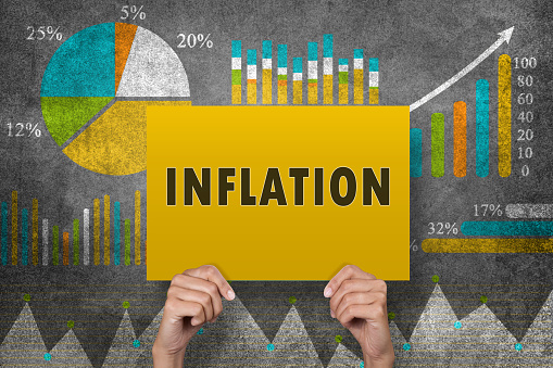 Inflation Sign In Front Of Financial Report