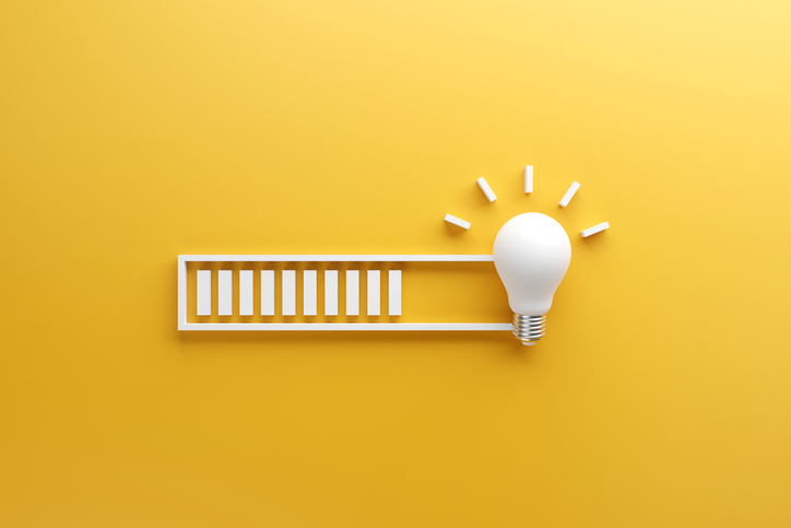 Loading Bar Almost Complete With Idea Beeing Processed On A Light Bulb On Yellow Background