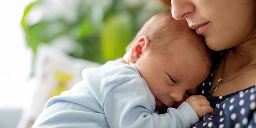A Mother Holding A Baby