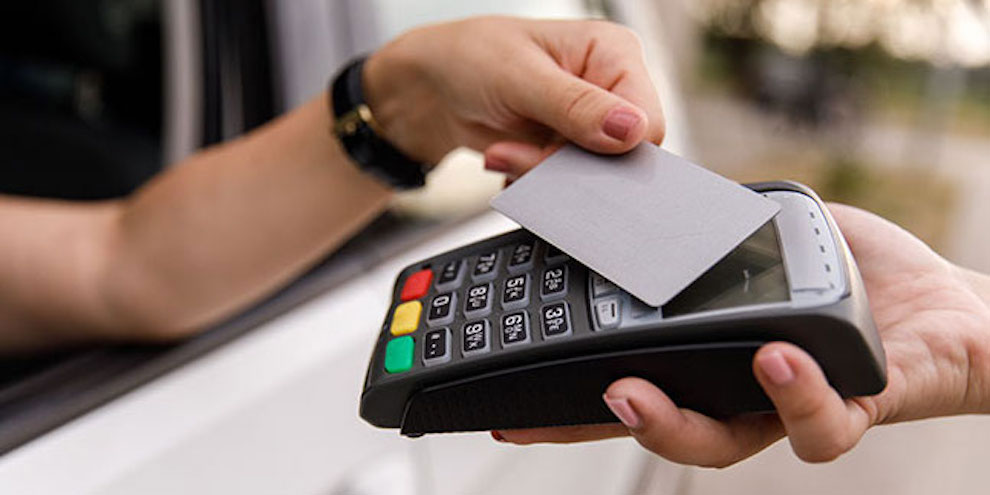 A Person Making A Card Payment