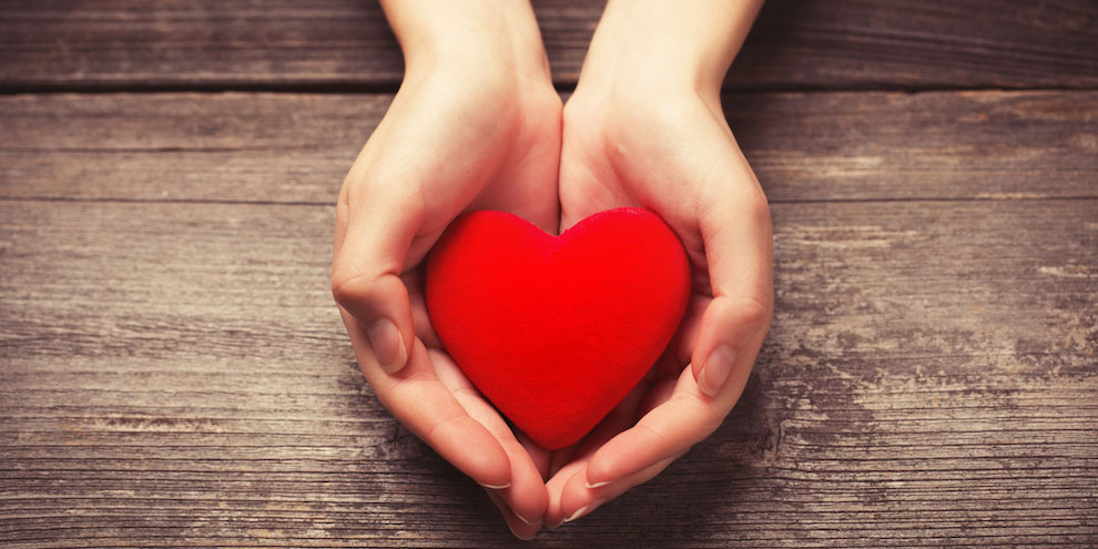 Hands Holding A Red Heart