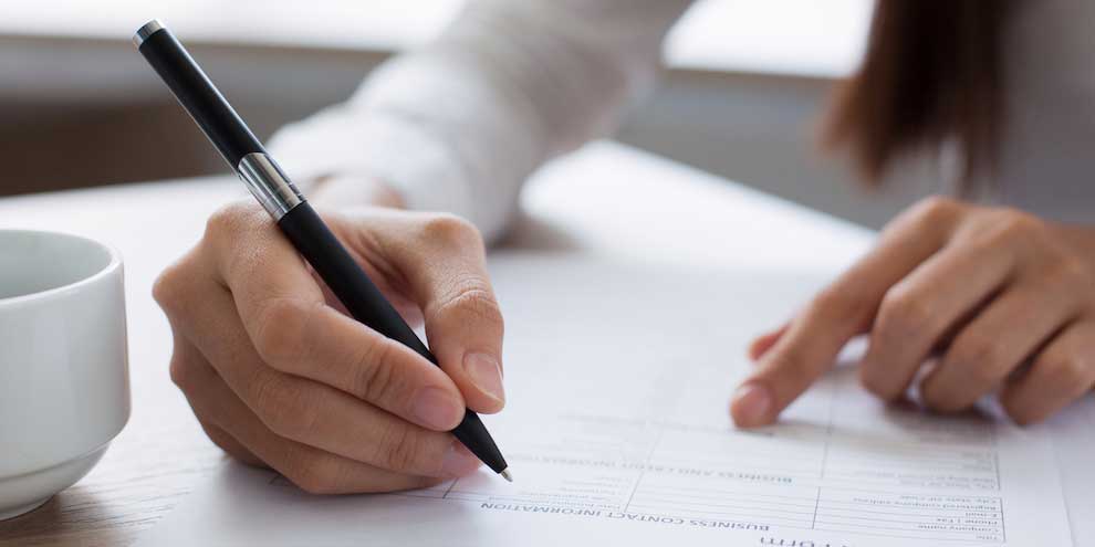 Respondent Writing A Written Response In Survey